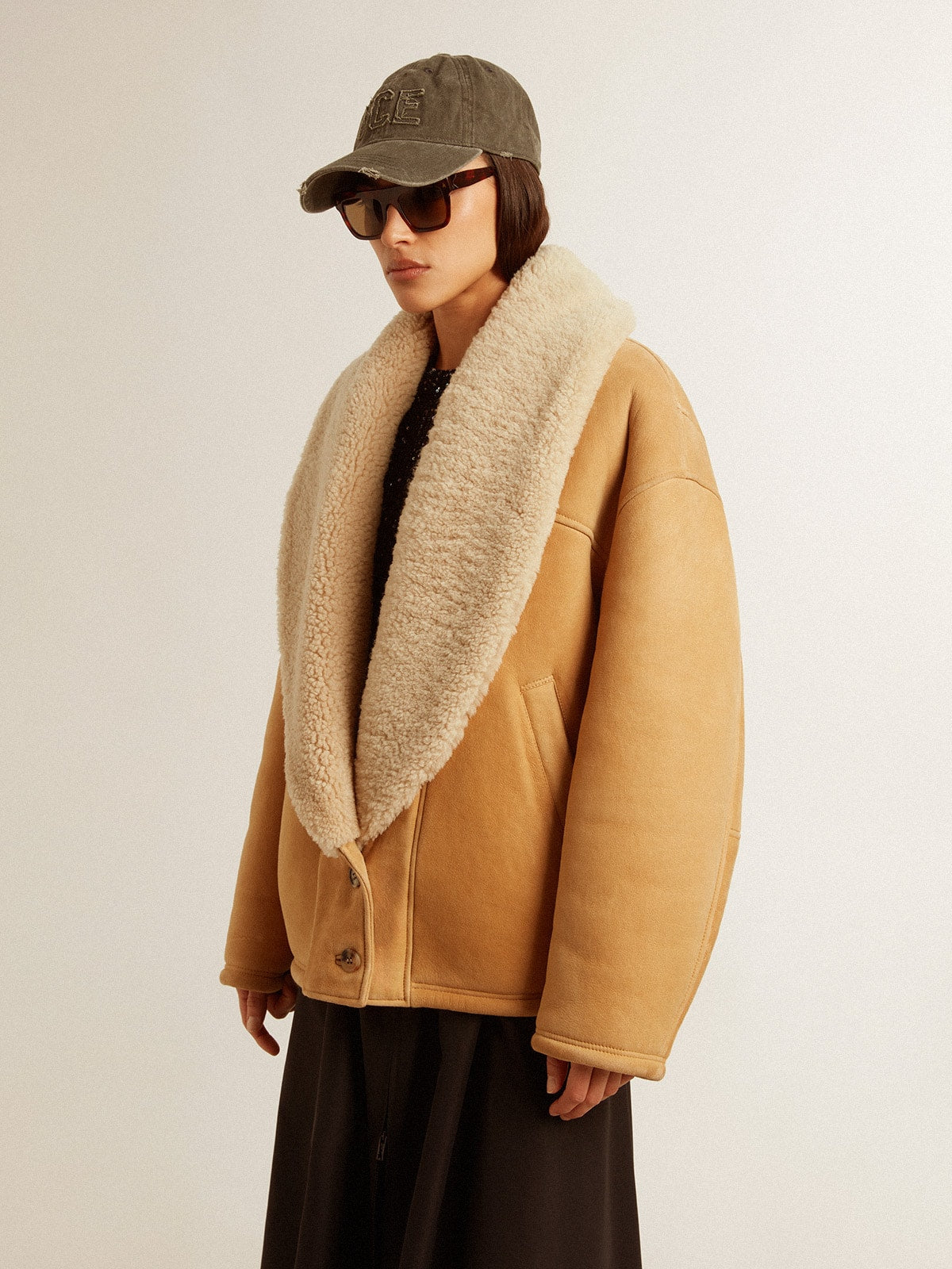 Women's sheepskin jacket with a wide shearling shawl collar