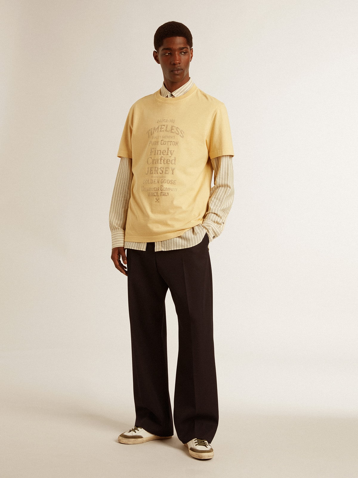 Men's cotton T-shirt in pale yellow with faded lettering