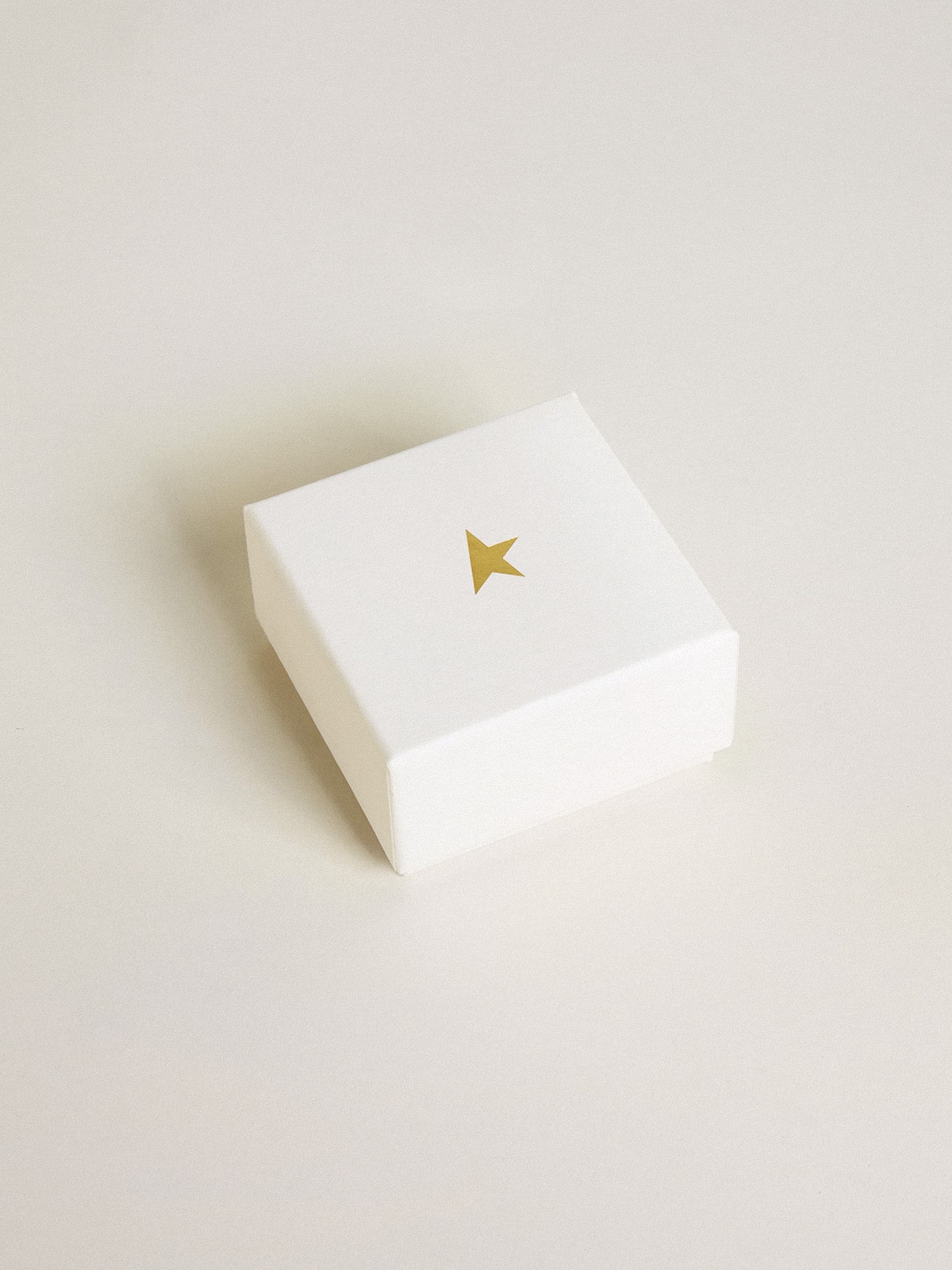 Key-shaped charm in gold-colored brass with crystals| Golden Goose