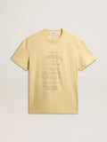 Men's cotton T-shirt in pale yellow with faded lettering