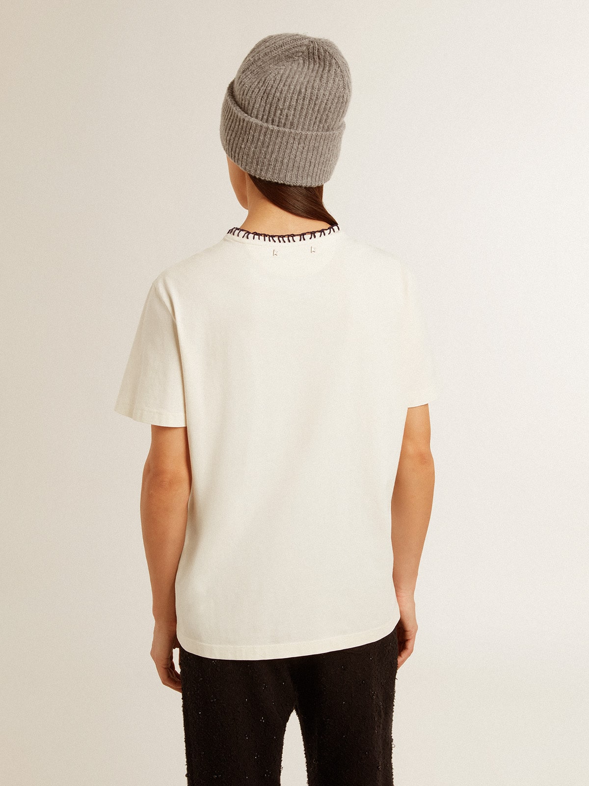 Women's aged white cotton T-shirt with hand embroidery